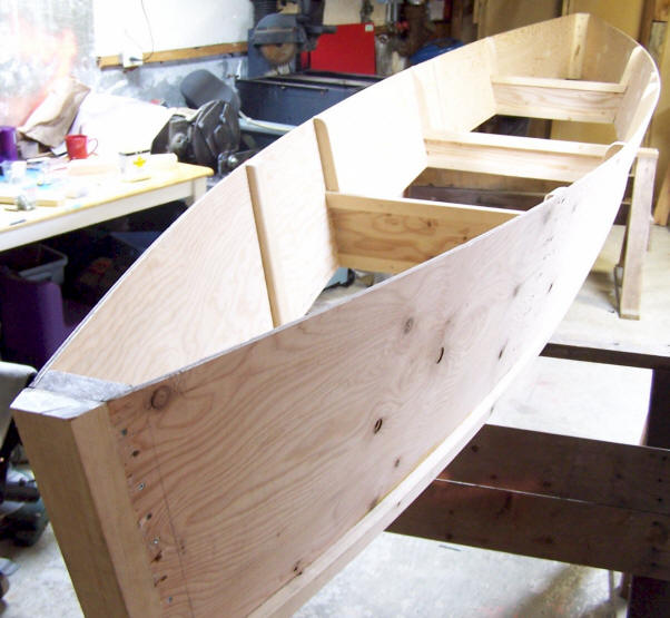 Partly finished canoe, showing outer stem and chine installed.