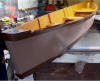 Canoe finished and painted, waiting to carry out of the basement